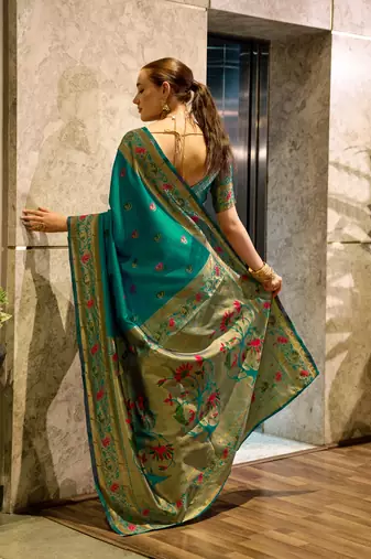 Teal green silk blend banarasi saree with unstitched blouse piece
