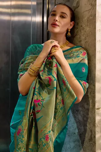 Teal green silk blend banarasi saree with unstitched blouse piece