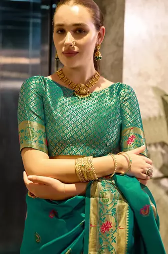 Teal green silk blend banarasi saree with unstitched blouse piece