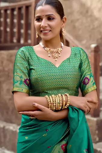 Teal green silk blend banarasi saree with unstitched blouse piece