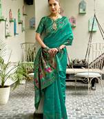 Teal green silk blend banarasi saree with unstitched blouse piece
