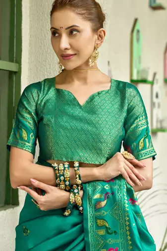 Teal green silk blend banarasi saree with unstitched blouse piece