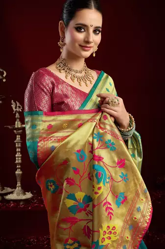 Teal green silk blend banarasi saree with unstitched blouse piece