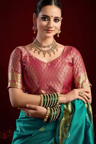Teal green silk blend banarasi saree with unstitched blouse piece
