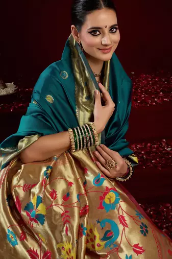 Teal blue silk blend banarasi saree with unstitched blouse piece