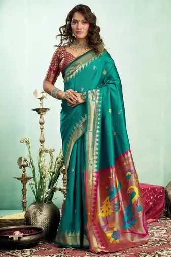 Teal green silk blend banarasi saree with unstitched blouse piece