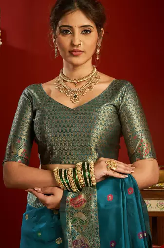 Teal blue silk blend banarasi saree with unstitched blouse piece