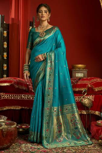 Teal blue silk blend banarasi saree with unstitched blouse piece