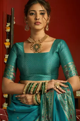 Teal blue silk blend banarasi saree with unstitched blouse piece