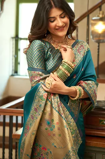 Teal blue silk blend banarasi saree with unstitched blouse piece
