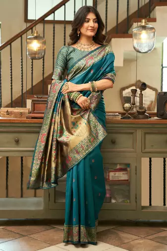 Teal blue silk blend banarasi saree with unstitched blouse piece