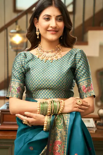 Teal blue silk blend banarasi saree with unstitched blouse piece