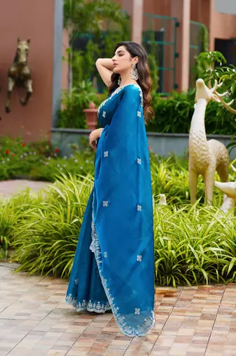 Turquoise shimmer chiffon embroidery saree with unstitched blouse piece