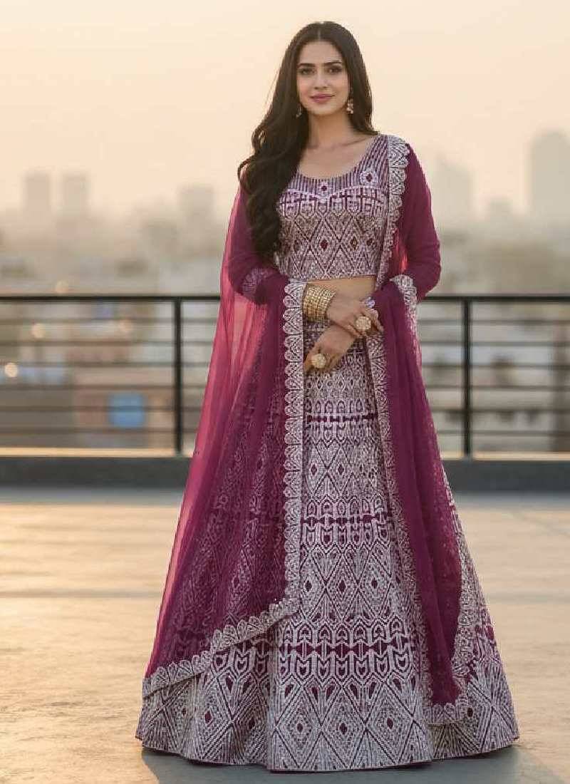 Wine Net Embroidered Lehenga Choli Set With Dupatta And Blouse Piece