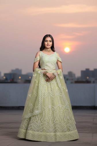 Light Yellow Net Embroidered Lehenga Choli Set With Dupatta And Blouse Piece