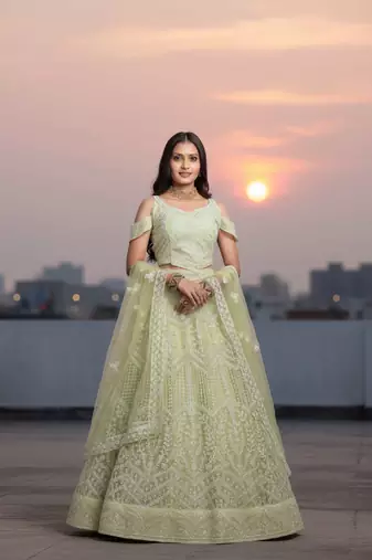 Light Yellow Net Embroidered Lehenga Choli Set With Dupatta And Blouse Piece