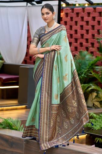 Teal green soft silk blend with woven work designer party wear festive saree with unstitched blouse piece