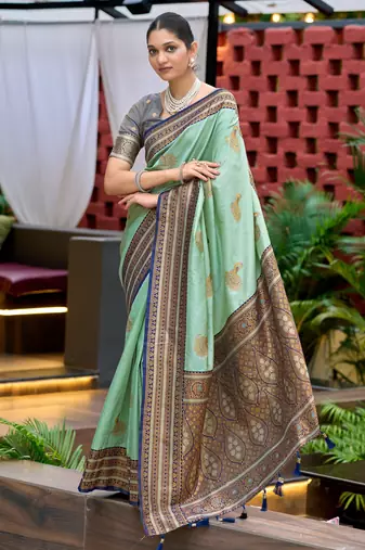 Teal green silk blend with woven saree with unstitched blouse piece