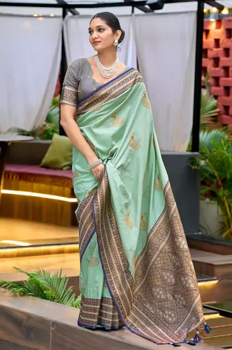 Teal green silk blend with woven saree with unstitched blouse piece