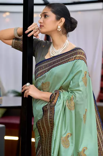 Teal green silk blend with woven saree with unstitched blouse piece