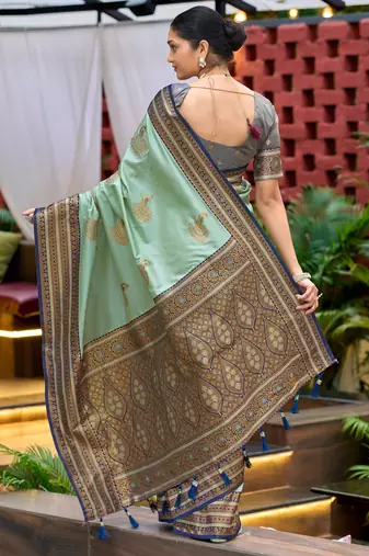 Teal green silk blend with woven saree with unstitched blouse piece