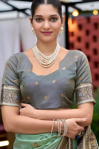 Teal green silk blend with woven saree with unstitched blouse piece