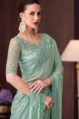 Sea green soft silk blend embroidered saree with unstitched blouse piece