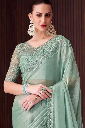 Sea green soft silk blend embroidered saree with unstitched blouse piece