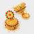  gold plated traditional jhumka earrings with red and green stones