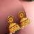  gold plated traditional jhumka earrings with red and green stones