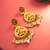  temple design gold plated earrings with green & red stones