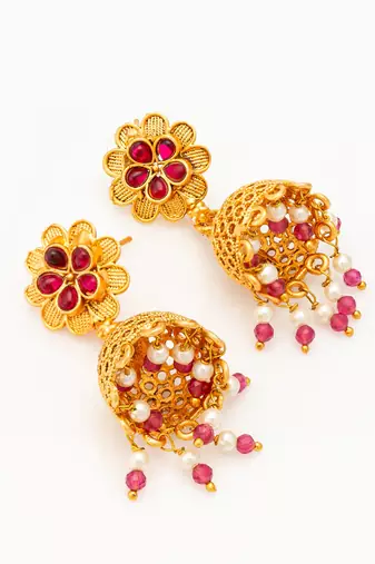  gold plated floral jhumka earrings with pink stone accents