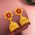  floral gold plated pink and green jhumka earrings