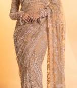 Light beige net saree with sequins embroidery work