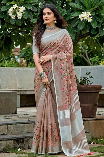 women linen saree with  embroidery and tassel pallu