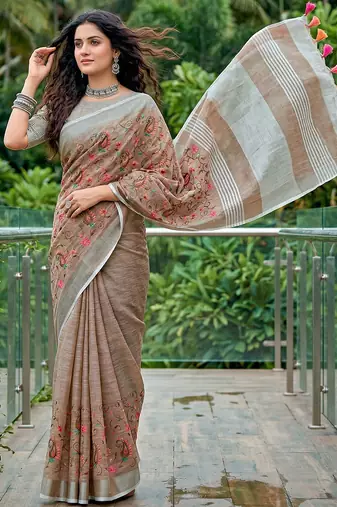 women linen saree with embroidery and tassel pallu