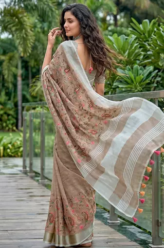 women linen saree with embroidery and tassel pallu