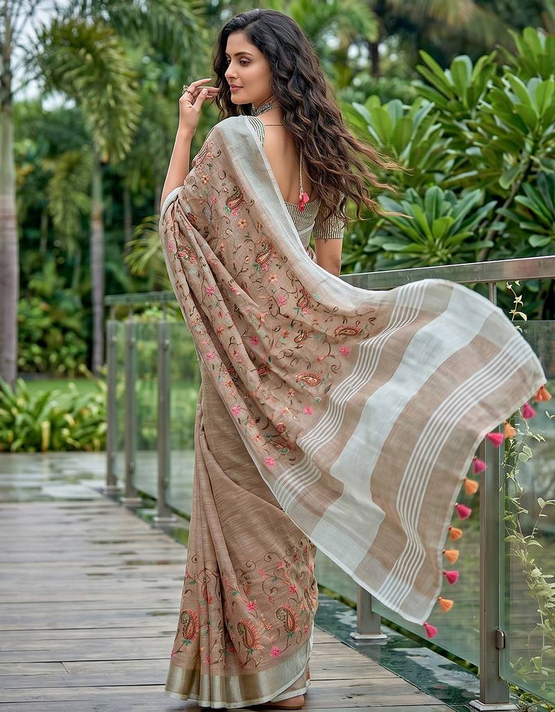 women linen saree with  embroidery and tassel pallu