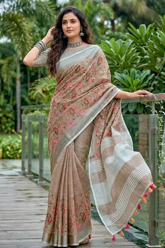 women linen saree with embroidery and tassel pallu