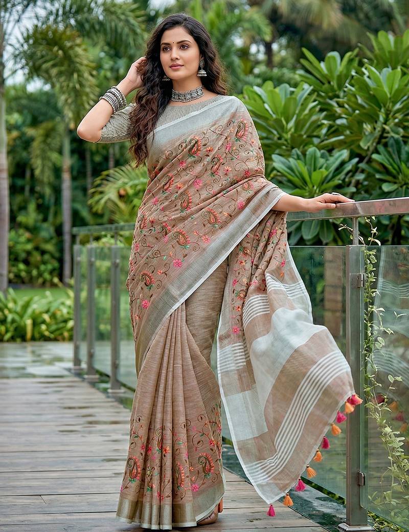 women linen saree with  embroidery and tassel pallu