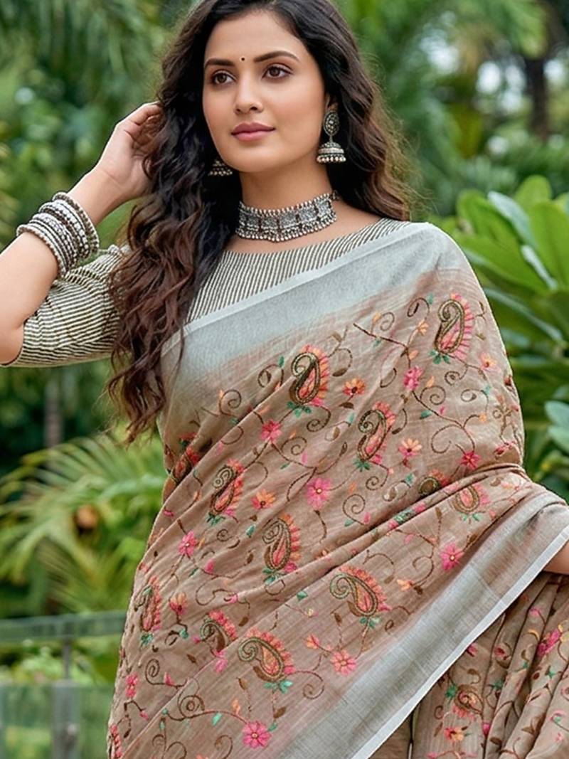 women linen saree with  embroidery and tassel pallu