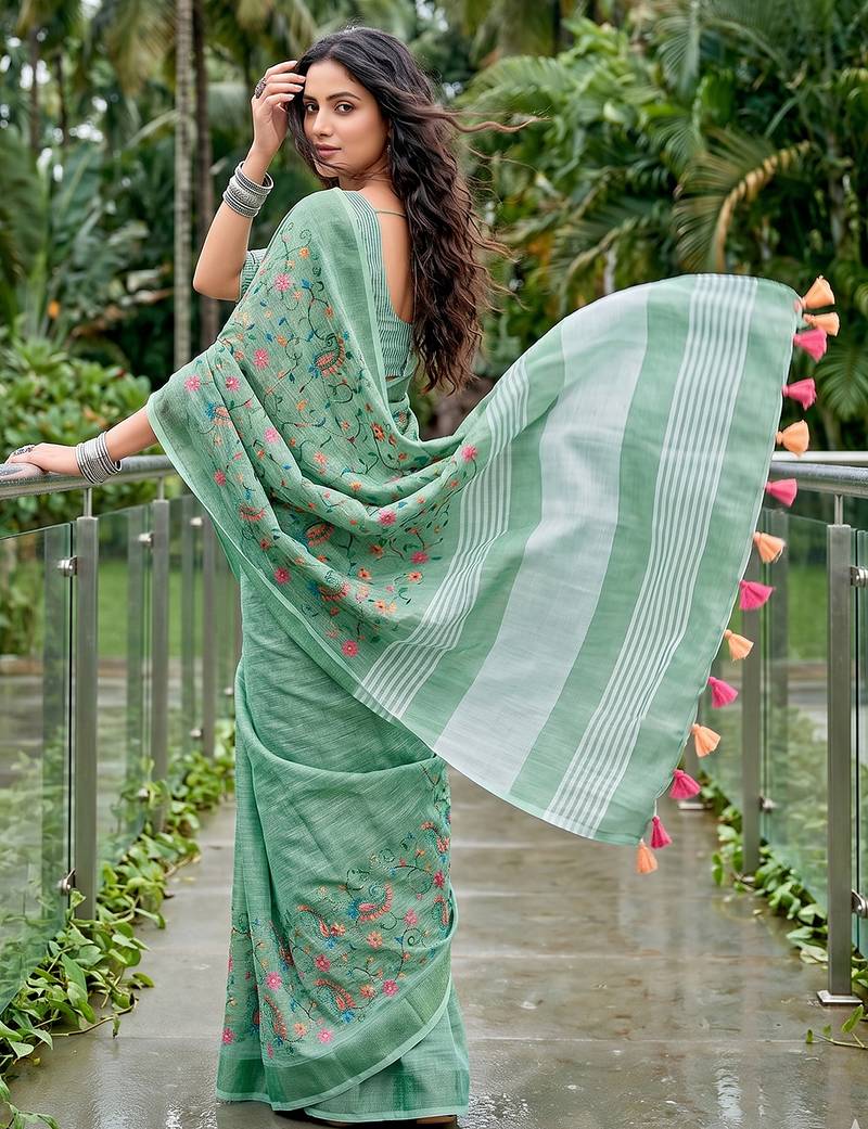 women linen saree with  embroidery and tassel pallu