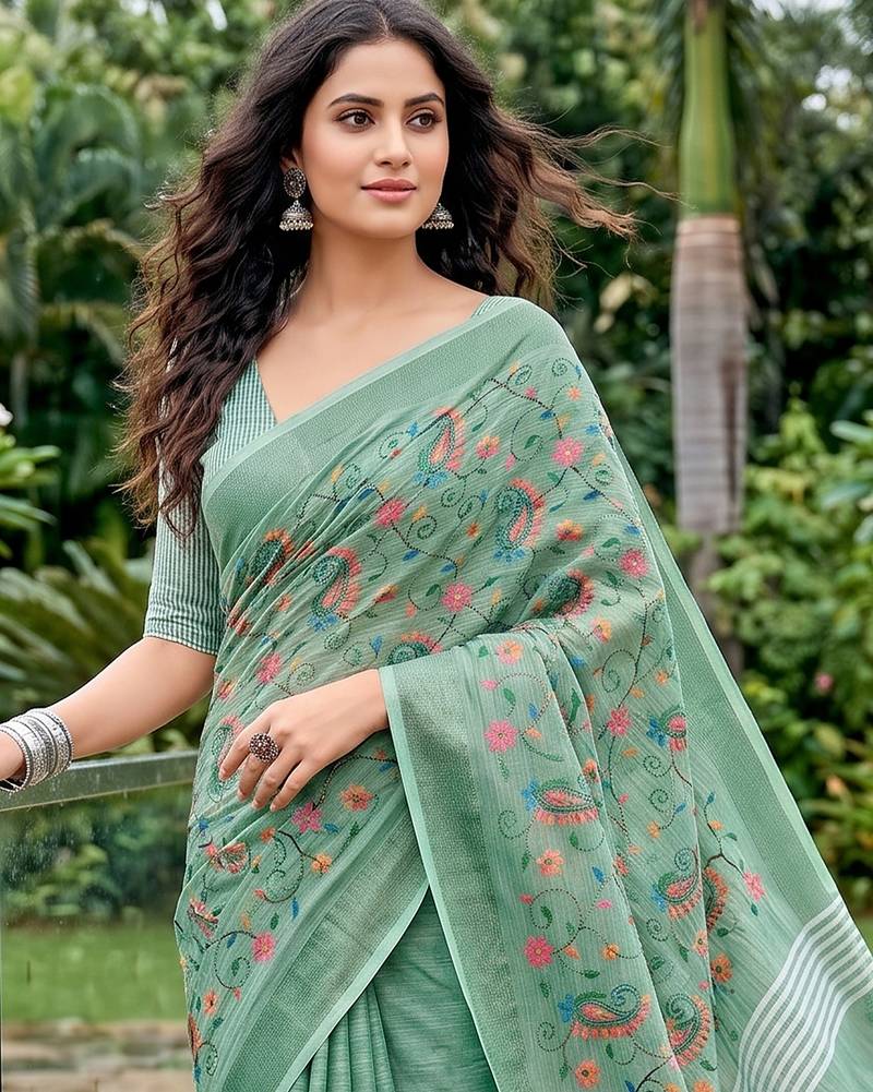 women linen saree with  embroidery and tassel pallu