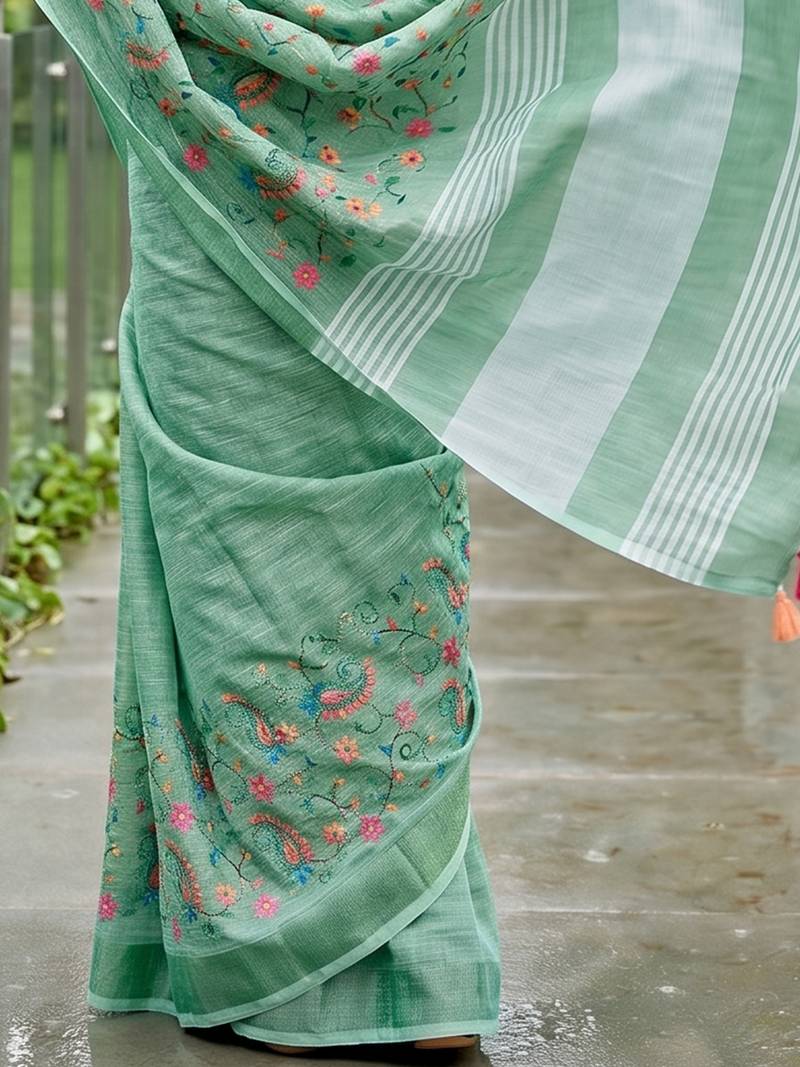 women linen saree with  embroidery and tassel pallu