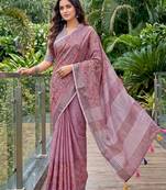 women linen saree with  embroidery and tassel pallu