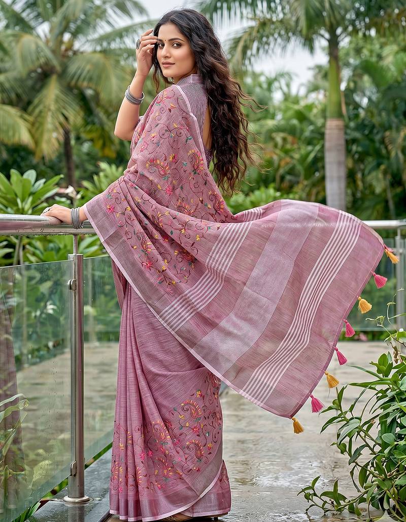 women linen saree with  embroidery and tassel pallu