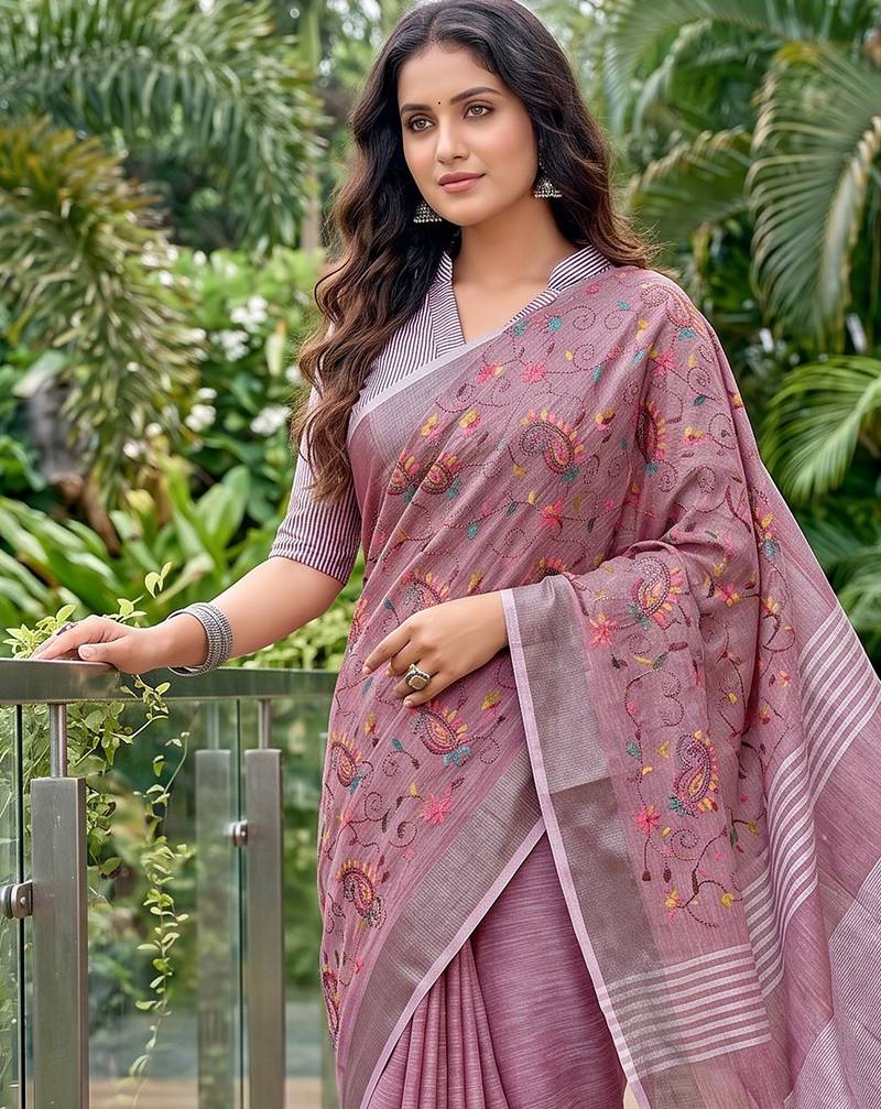 women linen saree with  embroidery and tassel pallu