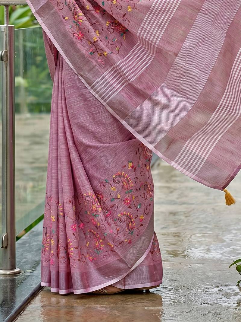 women linen saree with  embroidery and tassel pallu