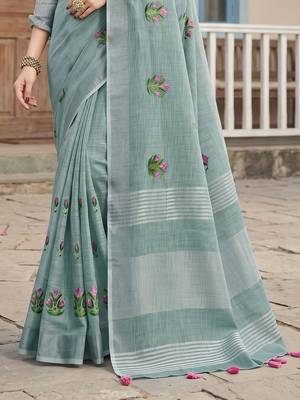 women sea green linen saree with floral embroidery border & tassels 4