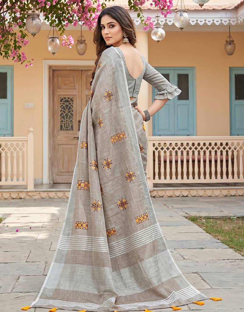 women brown linen saree with floral embroidery border & tassels